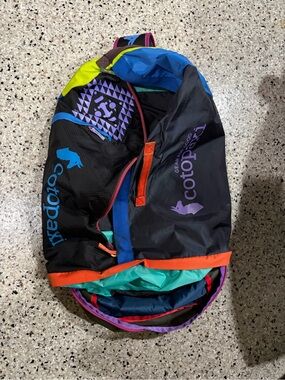 cotopaxi Black Backpack with Teal, Purple & Orange Accents